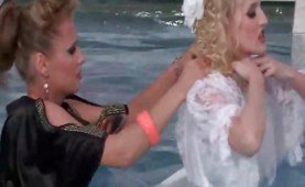 Dressed chicks catfighting in the pool