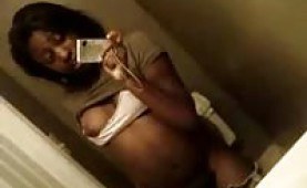 Black amateur girl flashing her tits in front of the mirror
