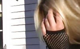 Blonde hottie toying with a huge dildo outdoors 