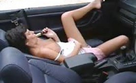 Sweet brunette toying herself inn a car