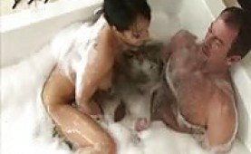 Asian babe gives an oily handjob massage