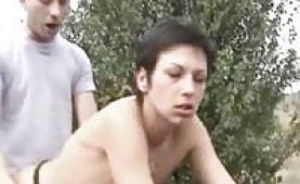 Busty chick fucked on a car at the side of a road