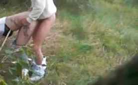 Amateur couple having sex in the field