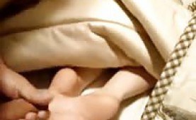 Sleeping girls gets a cumload on the soles of her feet