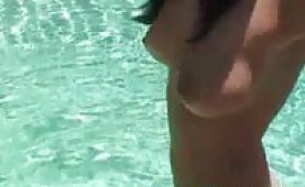 Kissable hottie gets naked at the poolside