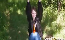 Teen playing with her toy in the woods