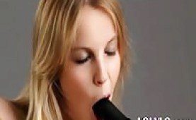 Horny blonde playing with her black toy