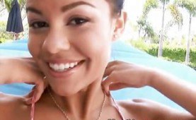 Naughty brunette meets a well hung guy by the pool