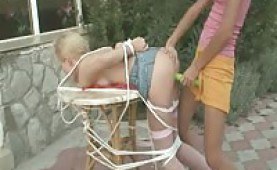 Teen girls playing bondage games in the garden