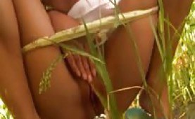 Sweety masturbating between the flowers