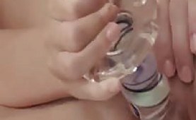 Hot babe playing with her big glass toy