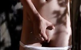 Sweet girl touching herself outdoors