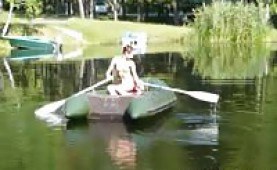 Teen cutie topless in a rubber boat