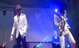 Handsome male stripper seducing and teasing a beautiful girl