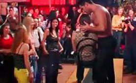Hot stud giving striptease at a party