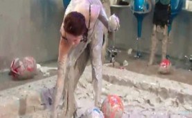 Dressed chicks fighting in a mud bath