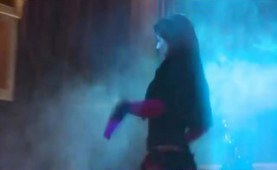 Super sexy brunette in black boots strips on stage