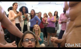 Blonde in glasses tugging two cocks