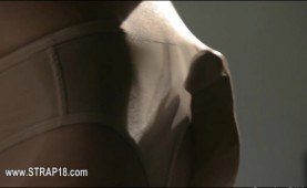 Babe in stockings experimenting on a strap on