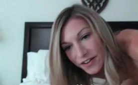 Skinny blonde playing her pussy on the bed