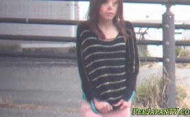 Bizarre asian whore urinating in public