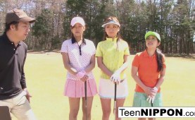 Cute Asian teen girls play a game of strip golf