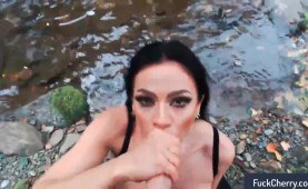 Bodacious brunette milf gives a deep blowjob in the outdoors