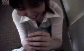 Asian teen sucks cock on a public toilet