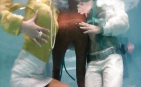 Three dressed babes in the pool