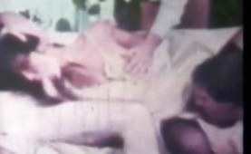 Retro chick fucked by three men