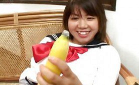 Asian teen playing with a banana