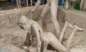 Dressed babes at a mudwrestling party